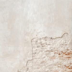 Muur met stuc en steentjes